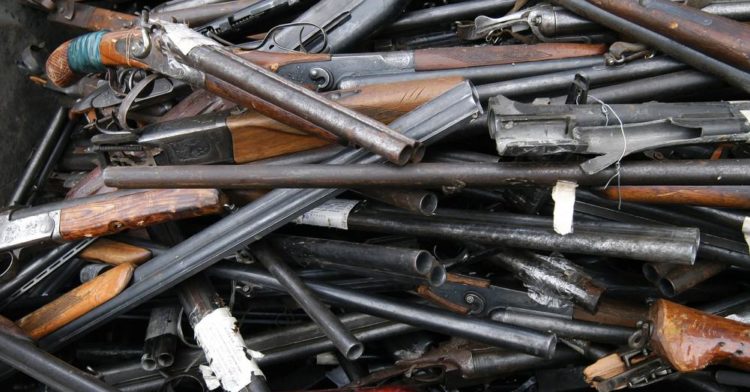 C:\Users\SN\Downloads\rubbish-of-the-broken-and-old-shotguns-rifles.jpg